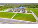 Aerial view of a large building with a parking lot and solar panels at 7353 Wash Island Dr, Sun City Center, FL 33573