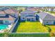 Aerial view showcasing the home's backyard and pool at 7353 Wash Island Dr, Sun City Center, FL 33573