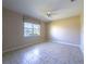 Inviting bedroom featuring a ceiling fan and a picturesque view of the serene lake through the window at 16233 Amethyst Key Dr, Wimauma, FL 33598