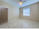 Spacious bedroom with tile flooring and ample natural light, designed for comfortable living and relaxation at 16233 Amethyst Key Dr, Wimauma, FL 33598