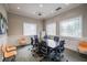 Bright conference room features a projector, large table and multiple chairs at 16233 Amethyst Key Dr, Wimauma, FL 33598