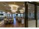 Well-lit dining area featuring tables and chairs; a sign indicates dining room rules at 16233 Amethyst Key Dr, Wimauma, FL 33598