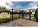 Well-maintained dog park entrance with secure fencing, providing a safe and fun environment for pets at 16233 Amethyst Key Dr, Wimauma, FL 33598