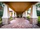 Beautifully designed main entrance featuring stone columns and brick pavers at 16233 Amethyst Key Dr, Wimauma, FL 33598
