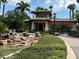 Community Entrance featuring a guard house, water feature and lush landscaping at 16233 Amethyst Key Dr, Wimauma, FL 33598