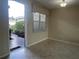 Inviting entryway offering a glimpse of the tile flooring and the view to the yard at 16233 Amethyst Key Dr, Wimauma, FL 33598
