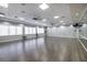 Flex space features a ballet bar, mirrors, and ceiling fans at 16233 Amethyst Key Dr, Wimauma, FL 33598