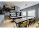 Community kitchen has commercial hood, stainless appliances, and ample seating at 16233 Amethyst Key Dr, Wimauma, FL 33598