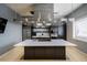 Modern kitchen with island, stainless steel appliances, and sleek finishes at 16233 Amethyst Key Dr, Wimauma, FL 33598