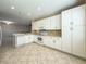 Well-maintained kitchen with stainless steel appliances and tile flooring, offering both style and functionality at 16233 Amethyst Key Dr, Wimauma, FL 33598
