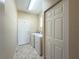 Functional laundry room with a washer, dryer, and storage closet, providing convenience and organization at 16233 Amethyst Key Dr, Wimauma, FL 33598