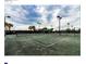 View of the community pickleball courts featuring multiple courts and shaded rest area at 16233 Amethyst Key Dr, Wimauma, FL 33598