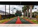 Community shuffleboard courts with mature trees, and shaded rest area at 16233 Amethyst Key Dr, Wimauma, FL 33598