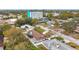 An aerial shot showing a single-Gathering home with a backyard and surrounding houses at 1557 Jeffords St, Clearwater, FL 33756