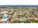 High-angle view of houses, roads, and businesses in a suburban setting at 1557 Jeffords St, Clearwater, FL 33756