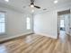 Bright bedroom featuring wood-look floors and a ceiling fan at 1557 Jeffords St, Clearwater, FL 33756