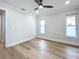 Spacious bedroom with wood-look floors and ceiling fan at 1557 Jeffords St, Clearwater, FL 33756