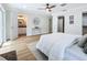 Bright bedroom with a queen bed, wood floors, and access to a private bathroom at 1557 Jeffords St, Clearwater, FL 33756