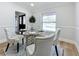 Bright dining area with a glass table and modern decor at 1557 Jeffords St, Clearwater, FL 33756