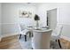 Elegant dining room featuring a glass-top table and four upholstered chairs at 1557 Jeffords St, Clearwater, FL 33756