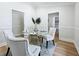 Elegant dining room featuring a round glass table and upholstered chairs at 1557 Jeffords St, Clearwater, FL 33756