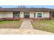 Inviting front entrance with a brick walkway leading to a double door at 1557 Jeffords St, Clearwater, FL 33756