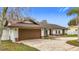 Brown garage door and freshly painted exterior at 1557 Jeffords St, Clearwater, FL 33756