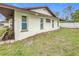 Exterior view of the house with landscaping and white fence at 1557 Jeffords St, Clearwater, FL 33756