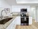 Kitchen corner with granite countertops and stainless steel sink at 1557 Jeffords St, Clearwater, FL 33756