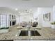 Kitchen view showcasing a breakfast bar overlooking living room at 1557 Jeffords St, Clearwater, FL 33756