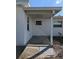 Back porch with concrete foundation and room for seating offers outdoor relaxation at 4415 96Th N Ave, Pinellas Park, FL 33782