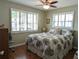 Bedroom with hardwood floors, fan and windows at 4415 96Th N Ave, Pinellas Park, FL 33782