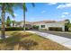 Well-maintained building exterior showcasing a red tile roof and neatly kept landscaping at 4415 96Th N Ave, Pinellas Park, FL 33782