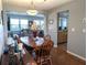 Inviting dining room features a wooden table and chairs, with views into the living room and kitchen at 4415 96Th N Ave, Pinellas Park, FL 33782