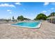 Outdoor community pool area with lounge chairs and a meticulously maintained pool, great for relaxation at 4415 96Th N Ave, Pinellas Park, FL 33782