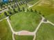 Aerial view of a park featuring pathways, open green spaces, trees, and manicured landscaping at 8319 Swiss Chard Cir, Land O Lakes, FL 34637