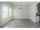 Spacious dining room with tile floors and a chandelier at 8319 Swiss Chard Cir, Land O Lakes, FL 34637