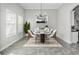 Elegant dining room featuring a chandelier and modern furniture at 8319 Swiss Chard Cir, Land O Lakes, FL 34637