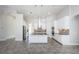 Spacious kitchen featuring white cabinetry, a center island, and stainless steel appliances at 8319 Swiss Chard Cir, Land O Lakes, FL 34637