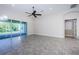 Bright living room with sliding glass doors leading to the backyard and open floor plan at 8319 Swiss Chard Cir, Land O Lakes, FL 34637