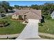 Beautiful single-story home featuring a manicured lawn and a spacious two-car garage, offering comfort and curb appeal at 8949 Bay Pointe Ct, Hudson, FL 34667