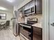 Kitchen with stainless steel appliances and microwave at 9100 Dr Martin Luther King Jr N St # 516, St Petersburg, FL 33702