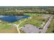 Scenic aerial view of a community park with lake, playground, dog park, and picnic areas at 13608 S Village Dr # 6203, Tampa, FL 33618