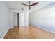 Bright bedroom with laminate floors, ceiling fan and closet at 13608 S Village Dr # 6203, Tampa, FL 33618