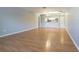 Bright living room with updated flooring and neutral walls, leading to an open kitchen at 13608 S Village Dr # 6203, Tampa, FL 33618