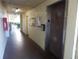 Building hallway with elevator and mailboxes at 14130 Rosemary Ln # 2102, Largo, FL 33774