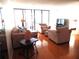 Bright condo living room with hardwood floors and sliding doors at 14130 Rosemary Ln # 2102, Largo, FL 33774