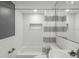 Modern bathroom with white subway tile and shower/tub combo at 1428 Illinois Ave, Palm Harbor, FL 34683