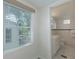 Clean bathroom with white subway tile, vanity, and toilet at 1428 Illinois Ave, Palm Harbor, FL 34683