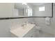 Updated bathroom with white subway tile and a white vanity at 1428 Illinois Ave, Palm Harbor, FL 34683